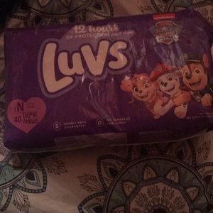 New born luv dipers never been open brand new
